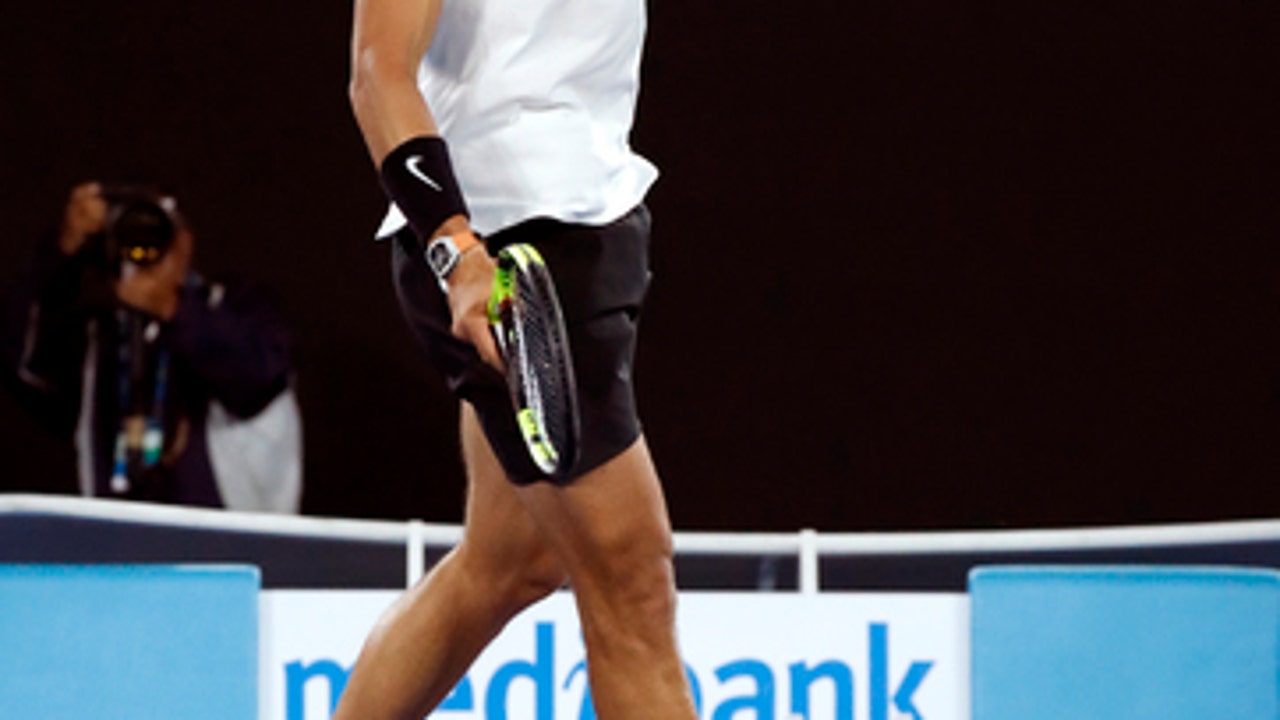 The Latest: Nadal beats Raonic, returns Grand Slam semis